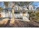 Two-story house with a large front porch and landscaping at 3979 Doral Cir, Atlanta, GA 30360