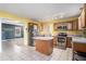 Kitchen with yellow walls, wood cabinets, and stainless steel appliances at 3979 Doral Cir, Atlanta, GA 30360