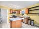 Kitchen with yellow walls, an island, and stainless steel appliances at 3979 Doral Cir, Atlanta, GA 30360