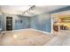 Living room with blue walls, carpet, and built-in shelving at 3979 Doral Cir, Atlanta, GA 30360