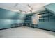 Spacious office with teal walls, built-in shelving, and window at 3979 Doral Cir, Atlanta, GA 30360