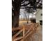 Landscaped backyard with wooden fence and large trees at 4045 Mark Todd Ct, Hoschton, GA 30548