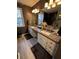 Elegant bathroom featuring double vanity and granite countertop at 4045 Mark Todd Ct, Hoschton, GA 30548