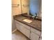 Bathroom vanity with granite countertop and white cabinets at 4045 Mark Todd Ct, Hoschton, GA 30548