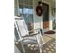 Relaxing front porch with rocking chairs and seasonal decor at 4045 Mark Todd Ct, Hoschton, GA 30548