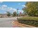 A street view of the community with mature trees and lush greenery at 3045 Wyntree Dr, Peachtree Corners, GA 30071