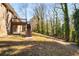 House backyard with deck and steps leading down to the yard at 1801 Se Caribaea Se Trl, Atlanta, GA 30316