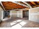 Unfinished basement area with high ceilings and potential for expansion at 1801 Se Caribaea Se Trl, Atlanta, GA 30316