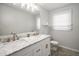 Bathroom with a double vanity and mosaic tile floor at 1801 Se Caribaea Se Trl, Atlanta, GA 30316