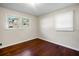 Bedroom with hardwood floors and two windows at 1801 Se Caribaea Se Trl, Atlanta, GA 30316