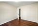 Simple bedroom with hardwood floors and an open door at 1801 Se Caribaea Se Trl, Atlanta, GA 30316