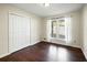 Bright bedroom with hardwood floors and double doors at 1801 Se Caribaea Se Trl, Atlanta, GA 30316