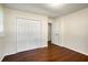 Bright bedroom with hardwood floors and double-door closet at 1801 Se Caribaea Se Trl, Atlanta, GA 30316