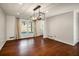 Bright dining room features hardwood floors and a modern chandelier at 1801 Se Caribaea Se Trl, Atlanta, GA 30316