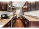 Modern kitchen with dark cabinetry and granite countertops at 1801 Se Caribaea Se Trl, Atlanta, GA 30316