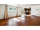 Sunlit living room showcasing hardwood floors and kitchen views at 1801 Se Caribaea Se Trl, Atlanta, GA 30316