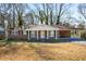 Brick ranch house with covered porch and large yard at 1801 Se Caribaea Se Trl, Atlanta, GA 30316