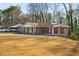 Brick house with covered porch and a yard at 1801 Se Caribaea Se Trl, Atlanta, GA 30316