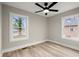 Well-lit bedroom with two windows and ceiling fan at 384 Saint Johns Sw Ave, Atlanta, GA 30315