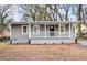 Charming gray house with white trim, a front porch, and well-manicured landscaping at 384 Saint Johns Sw Ave, Atlanta, GA 30315