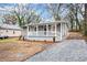 Charming house exterior with a gravel driveway at 384 Saint Johns Sw Ave, Atlanta, GA 30315