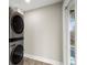 Modern laundry room with stacked washer and dryer, and exterior access at 384 Saint Johns Sw Ave, Atlanta, GA 30315