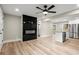 Open concept living area with modern fireplace and kitchen access at 384 Saint Johns Sw Ave, Atlanta, GA 30315