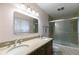 Bathroom with double vanity, granite countertop and walk in shower at 620 Oakstone Way, Roswell, GA 30075