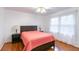 Bedroom with hardwood floors, double bed, and neutral decor at 620 Oakstone Way, Roswell, GA 30075