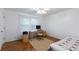 Cozy bedroom with hardwood floors, ceiling fan, and neutral walls provides a relaxing retreat at 620 Oakstone Way, Roswell, GA 30075