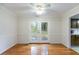 Bright dining room featuring wood floors, chair rail detail, and sliding glass doors at 620 Oakstone Way, Roswell, GA 30075