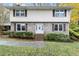 Charming two-story home with brick facade and well-maintained landscaping provides great curb appeal at 620 Oakstone Way, Roswell, GA 30075