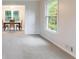 Living room with carpet and dining room set in background at 620 Oakstone Way, Roswell, GA 30075