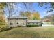 Expansive backyard of brick home provides a private outdoor living and entertainment space at 620 Oakstone Way, Roswell, GA 30075