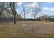 Expansive backyard featuring trees, grass, and a wooden fence at 97 Grayson New Hope Rd, Grayson, GA 30017