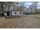 Backyard featuring a storage shed, garden beds, and stepping stone pathway at 97 Grayson New Hope Rd, Grayson, GA 30017