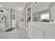 Bright bathroom with a double vanity, a walk-in shower, and marble-tiled walls at 97 Grayson New Hope Rd, Grayson, GA 30017