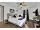 Primary bedroom featuring a gray headboard and dark wood floors at 97 Grayson New Hope Rd, Grayson, GA 30017