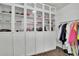 Organized closet with glass door cabinets and clothing rack at 97 Grayson New Hope Rd, Grayson, GA 30017