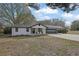 Charming home with a black front door, manicured lawn, and an attached two car garage at 97 Grayson New Hope Rd, Grayson, GA 30017