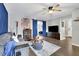 Cozy living room featuring modern furnishings, hardwood floors, and a pop of color with blue accents at 97 Grayson New Hope Rd, Grayson, GA 30017