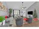 Cozy living room with gray walls, vaulted ceilings, fireplace, modern furnishings, and natural light at 97 Grayson New Hope Rd, Grayson, GA 30017