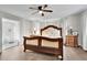 Serene main bedroom with hardwood floors, a plush bed, and access to the ensuite bathroom at 97 Grayson New Hope Rd, Grayson, GA 30017