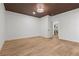 Bedroom with wood-look floors and access to a bathroom at 1337 Fairfield Dr, Lilburn, GA 30047