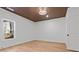 Bright bedroom with wood-look floors and a window at 1337 Fairfield Dr, Lilburn, GA 30047