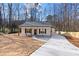 Newly built home with front porch and driveway at 1337 Fairfield Dr, Lilburn, GA 30047