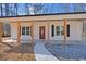 Front view of charming house with covered porch at 1337 Fairfield Dr, Lilburn, GA 30047