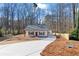 Newly built home with gray roof, front porch, and a long driveway at 1337 Fairfield Dr, Lilburn, GA 30047
