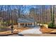 Newly built home with gray roof and a large front yard at 1337 Fairfield Dr, Lilburn, GA 30047