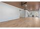 Open concept living room with kitchen and wood floors at 1337 Fairfield Dr, Lilburn, GA 30047